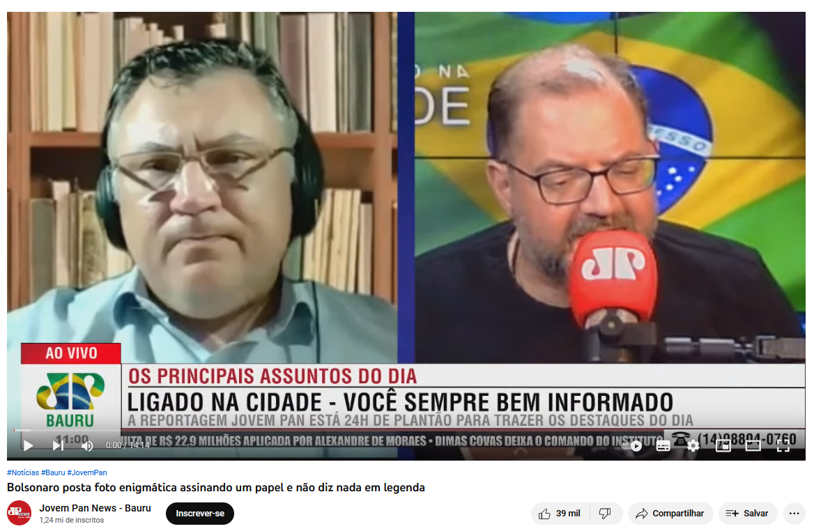 Print de vídeo em que apresentadores da JP News de Bauru interpretam foto de Bolsonaro