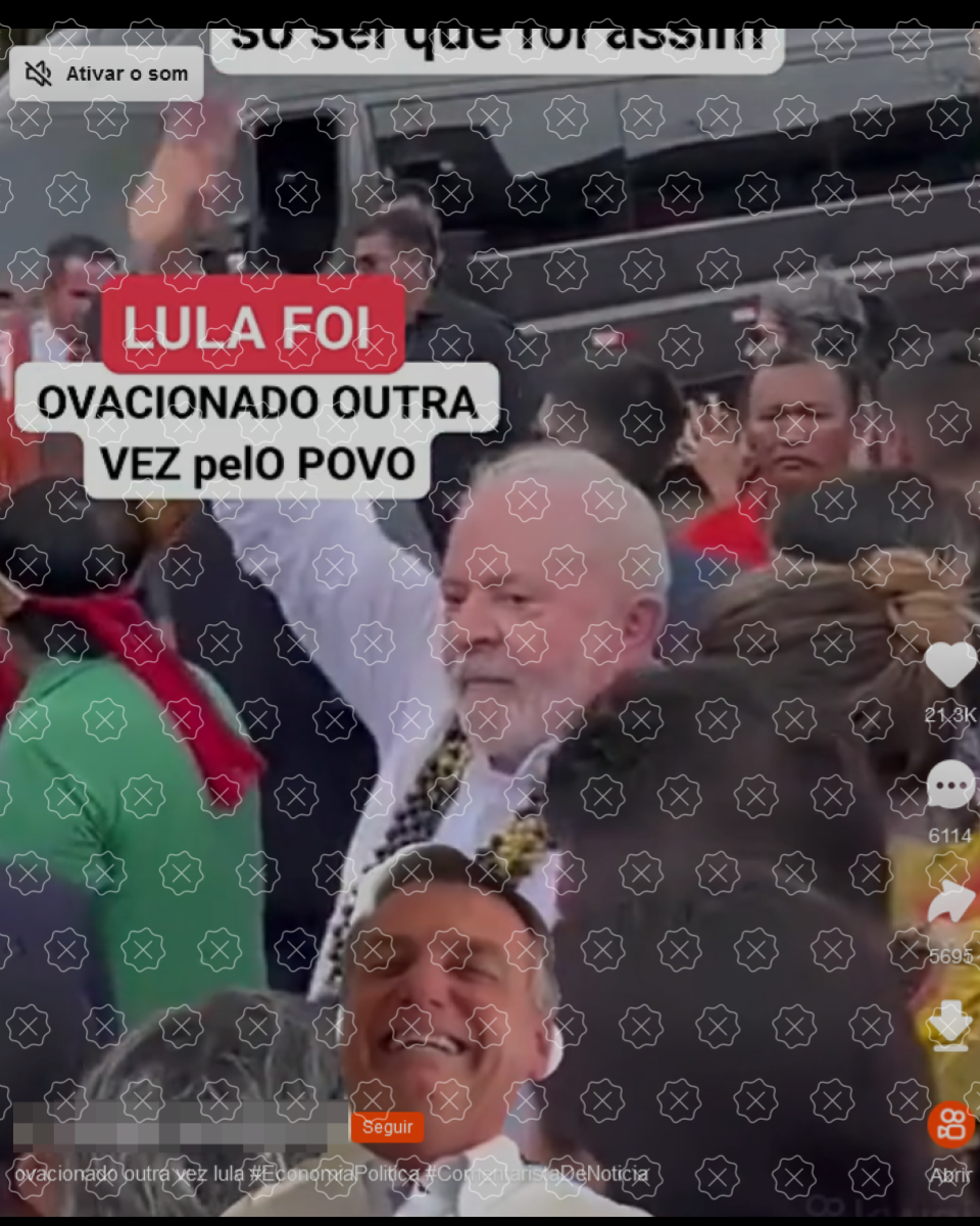 Print de vídeo mostra presidente Lula acenando, cercado de pessoas. Montagem traz foto do ex-presidente Jair Bolsonaro rindo e texto Lula foi ovacionado outra vez pelo povo 