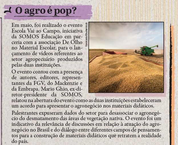 Página de material impresso com fundo em tom bege. No canto superior esquerdo, há o título ‘O agro é pop?’ destacado em uma faixa roxa. Abaixo do título, aparece um texto em colunas que descreve um evento relacionado ao setor agropecuário e à produção de materiais didáticos. À direita, há uma fotografia que mostra uma colheitadeira verde em uma área rural ampla, com grande quantidade de grãos amarelados espalhados no chão e no reboque, sob um céu claro.