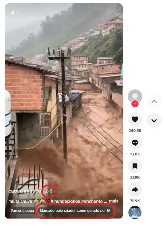 Captura de tela de vídeo com cena de enchente em área urbana, onde água barrenta escoa por rua cercada por casas de alvenaria em tons de vermelho e bege, construídas em encosta. Um poste de energia atravessa o centro da imagem, e há moradias distribuídas pela colina. À direita, aparecem ícones de interação, como curtidas, comentários e compartilhamentos, com números exibidos. Na parte inferior, lê-se o nome do perfil ‘caosclimatico’,  a descrição ‘muita chuva’ com emojis, a indicação da data “8 de fevereiro” e o aviso ‘Marcado pelo criador como gerado por IA’, destacados na tela.