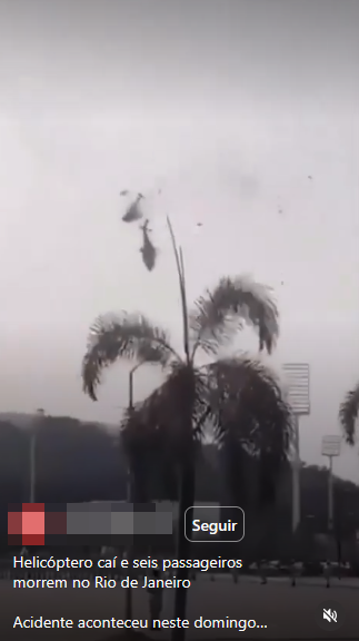 Imagem mostra uma captura de tela de um vídeo em rede social. No centro da imagem, dois helicópteros aparecem em queda no céu nublado, com partes aparentemente se desprendendo das aeronaves. Em primeiro plano há palmeiras e postes de iluminação. Na parte inferior da tela aparecem elementos da interface da plataforma, incluindo um botão com o texto ‘Seguir’. A legenda visível diz: ‘Helicóptero cai e seis passageiros morrem no Rio de Janeiro’, seguida do texto parcial: ‘Acidente aconteceu neste domingo...’. Alguns elementos no canto inferior esquerdo estão parcialmente ocultados por uma faixa pixelizada. 
