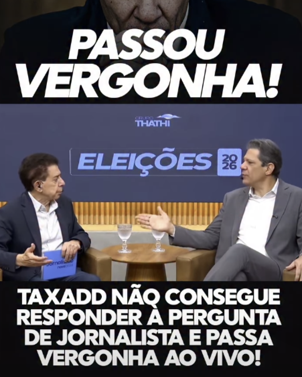 A imagem é uma montagem em formato vertical dividida em duas partes. Na parte superior, sobre um fundo escuro, aparece em letras grandes e brancas a frase 'PASSOU VERGONHA!'. Logo abaixo, ocupa a maior parte da imagem um frame de uma entrevista em estúdio. Fernando Haddad e Heródoto Barbeiro estão sentados frente a frente em poltronas, separados por uma pequena mesa redonda de madeira com dois copos de água. À esquerda está Barbeiro, que segura um cartão azul enquanto olha para o entrevistado. À direita está Haddad, que veste terno cinza e camisa branca, está sentado com as pernas cruzadas e faz um gesto com a mão direita estendida em direção ao apresentador. Ao fundo, há um painel azul com o logotipo 'Grupo Thathi' e a inscrição 'ELEIÇÕES 2026'. Na parte inferior da montagem, sobre uma faixa preta, aparece uma frase em letras brancas maiúsculas: 'TAXADD NÃO CONSEGUE RESPONDER À PERGUNTA DE JORNALISTA E PASSA VERGONHA AO VIVO!'.